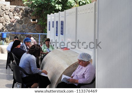 TEBERIAS - JUNE 16:Jewish women prays at Maimonides tomb on June 16 2009 in Tiberias, Israel. Maimonides tomb has become one of the most important Jewish pilgrimage sites in Israel.