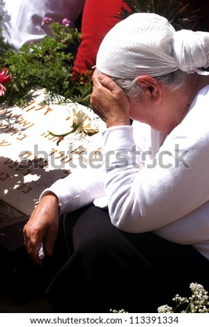 JERUSALEM - APRIL 23:A mother of fallen soldiers at the ceremony to mark Memorial Day or Yom Hazikaron at the Memorial Service for Victims of Terror on Mount Herzl in Jerusalem April 23, 2007