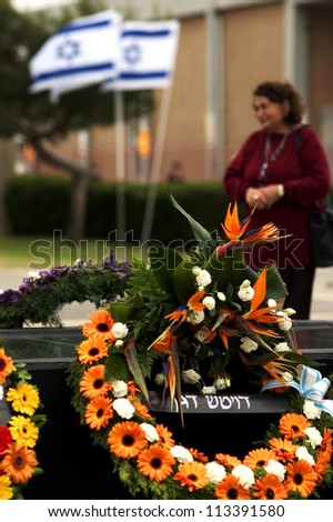 ASHKELON - MAY 05: Israeli woman that lost her son in a war participat in a memorial ceremony on May 05 2006 in Ashkelon, Israel.The day commemorates the deaths of Israeli soldiers at war