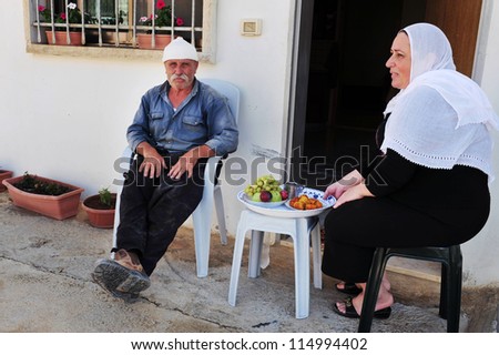 MAJDAL SHAMS - AUGUST 23:A Druze husband and wife in Majdal Shams,Israel on August 23 2009.The number of Druze people worldwide exceeds one million, with the vast majority residing in the Middle East.