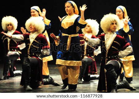 ASHDOD - MARCH 08: Georgian dancers dancing a folklore dance show on stage on March 08 2010 in Ashdod, Israel.It's a mountain dance that best representative of the Georgian people spirit.