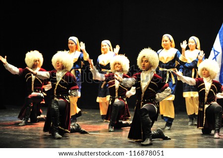 ASHDOD - MARCH 08: Georgian dancers dancing a folklore dance show on stage on March 08 2010 in Ashdod, Israel.It\'s a mountain dance that best representative of the Georgian people spirit.