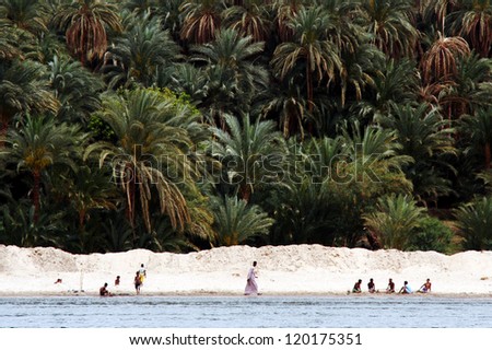ASWAN, EGYPT - APRIL 30: Egyptian people on the  river bank of the Nile , Egypt on April 30 2007.It\'s the longest river in the world - 6,650 km (4,130 miles) long.