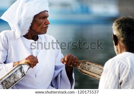 ASWAN - APRIL 28:An Egyptian Nubian people in a boat on the Nile near Aswan, Egypt on April 28 2007.It\'s ethnic group originally from northern Sudan, and southern Egypt.