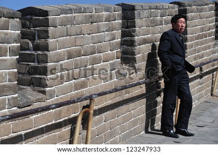 BEIJING - MARCH 10:Chines man on the Great Wall of China on March 10 2008. The Great Wall of China is the longest man-made structure in the world.