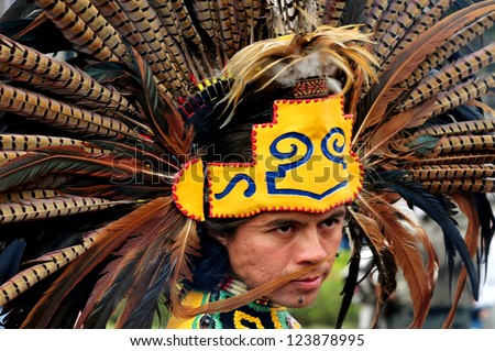MEXICO CITY-FEB 23:Portrait of Male Aztec Indian wearing traditional clothing and headdress at Zocalo Square on February 23 2010 in Mexico City.Since 1982 the Zocalo become cultural events center