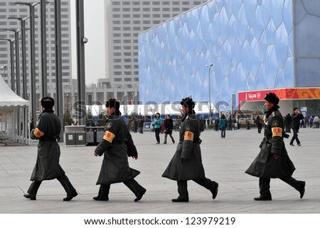 BEIJING - MARCH 14:Chinese soldiers guards Beijing National Aquatics Center on March 14 2009 in Beijing,China.It hosted the swimming, diving and synchronized swimming events of  2008 Summer Olympics