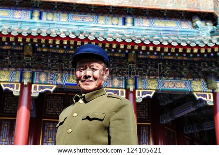 BEIJING - MARCH 14:An old Chinese man wearing Mao Tzetung suite and hat visit at the Summer Palace in Beijing, China on March 14 2007.Chairman Mao Zedong is still being worshiped all over China.