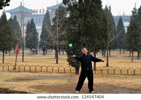 BEIJING-MARCH 15:Chinese man plays with Yo-yo at the temple of heaven park on Mar 15 2009 in Beijing,China.It\'s the most popular park in Beijing used by thousands of people for sport and leisure daily