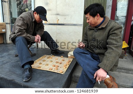 BEIJING - MAR 14:Chinese people play Xiangqi (Chinese Chess) in Beijing,China on March 14 2009.It\'s one of the most popular board game in the world, played by millions of people in China and Asia.