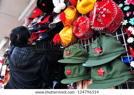 BEIJING - MARCH 11:Mao Zedong hats for sale at The Forbidden City on March 11 2009 in Beijing,China.Mao Zedong was the founding father of the People\'s Republic of China from its establishment in 1949.