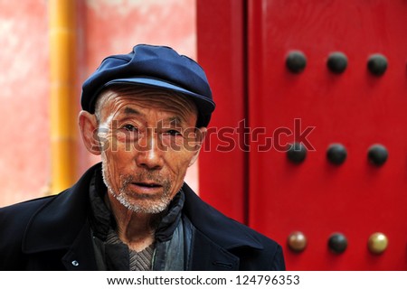 BEIJING - MARCH 11:Chinese man at the Forbidden City on March 11 2009 in Beijing,China. The average life expectancy among Chinese men is 72 years.