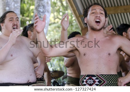 WAITANGI - FEB 6:Maori men sing and dance during Waitangi Day on February 6 2013 in Waitangi NZ.It\'s a New Zealand public holiday to celebrate the signing of the Treaty of Waitangi in 1840.