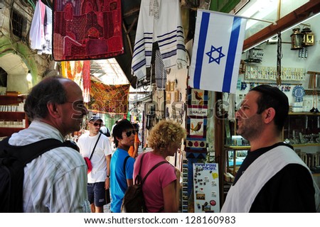 JERUSALEM - JULY 28: Jewish people at Jerusalem old city market on July 28 2009.Jerusalem is a holy city to the three major Abrahamic religions - Judaism, Christianity and Islam.