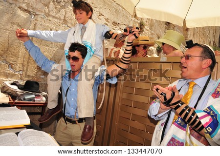 JERUSALEM -SEP 22: Bar Mitzvah ritual at the Wailing wall on September 22 2008 in Jerusalem, Israel.Boy who has become a Bar Mitzvah is morally and ethically responsible for his decisions and actions.
