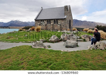 LAKE TEKAPO, NZ - MARCH 01: Visitors at the church of the good shepherd at  Lake Tekapo on March 01 2009. It is the most famous and photographed church in New Zealand.
