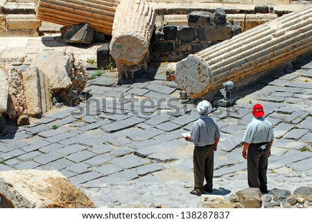 BEIT SHEAN,ISR - JUNE 17:Visitors walks under Pillars in Ancient Beit Shean on June 17 2009.Beit She'an is one of the most ancient sites in Israel: it was first settled 5-6 thousand years ago.