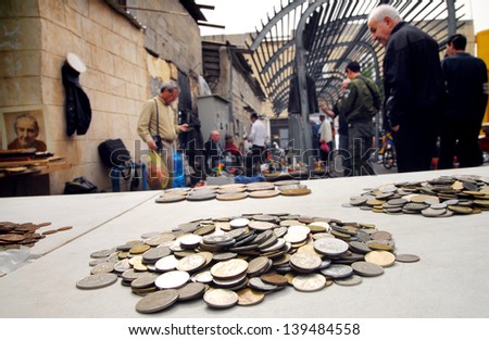 JAFFA,ISR - MAR 09:Old coins at the Flea Market in Jaffa on Mar 09 2008.It's an open air market throughout the year,a magnet for visitors, tourists and lovers of bargains and second hand items