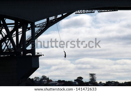 AUCKLAND,NZ - JUNE 02:A person during a  Bungee jump from  Auckland Harbour Bridge on June 02 2013. It\'s a 40m high bungy jump into Waitemata Harbour waters.