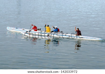 AUCKLAND, NZ - JUNE 02:Crew of a racing outrigger canoe training on June 02 2013. It become a very popular paddling sport with numerous sporting clubs located around the world.