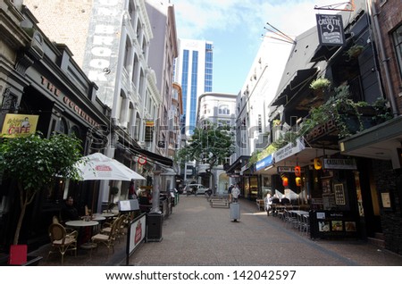 AUCKLAND, NZ - MAY 29:Vulcan Lane on May 29 2013.It's a popular cobblestone plaza off Queen St home to fashionable restaurants, cafes, pubs and stores.