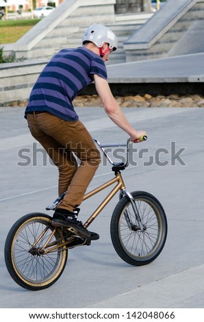 AUCKLAND, NZ - MAY 27:Young man rides his BMX Bike in Victoria park on May 27 2013.It became official Olympic sport in the 2008 Summer Olympic Games in Beijing, China.