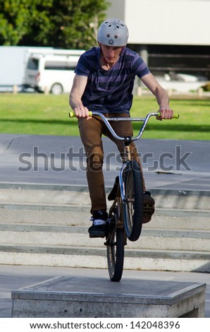 AUCKLAND, NZ - MAY 27:Young man jump with his BMX Bike Victoria park on May 27 2013.It became official Olympic sport in the 2008 Summer Olympic Games in Beijing, China.