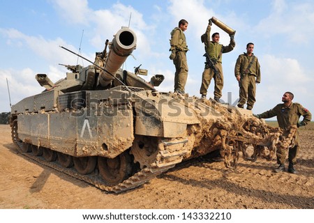 NACHAL OZ, ISR - NOV 12:Israeli soldiers on Merkava tank on NOV 12 2008.It\'s IDF battle tank designed for rapid repair of battle damage, survivability, cost-effectiveness and off-road performance.