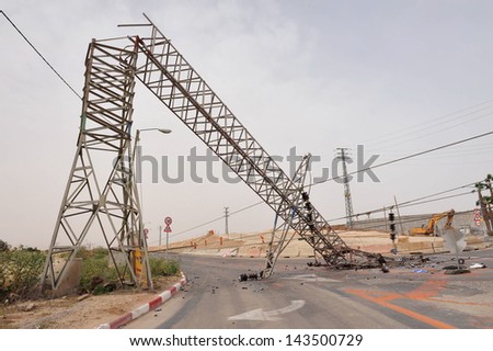 KIRYAT GAT, ISR - MAY 04:Toppled overhead power line on May 04 2009. High voltage transmission and distribution lines carry a lot of energy or power and if not treated with respect can be fatal.