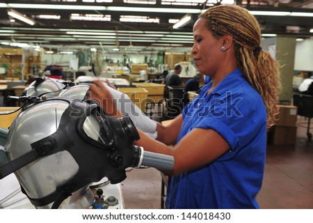 KIRYAT GAT, ISR - OCT 04:Worker at gas masks factory on Oct 04 2010.Only 58% percent of Israelis have gas masks.It estimated that it will coast $350 million USD to cover the rest of the population.