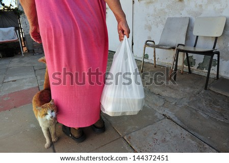 ASHKELON,ISR - NOV 08:Poor woman receive food portion on Nov 08 2010. 123,500 people joined the circle of poverty in Israel 2009 according to National Insurance Institute Poverty and Social Gaps Report