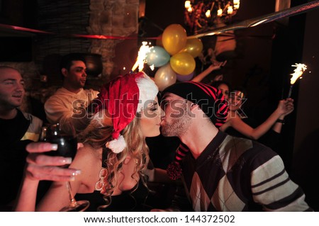 ASHDOD, ISR - JAN 01:Couple is kissing to welcome the new years on Jan 01 2010 .Israel is one country that uses the Gregorian calendar but does not formally celebrate the New Year\'s holiday.
