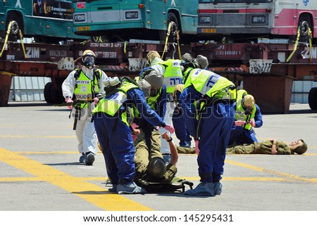 ASHDOD, ISRAEL - JUNE 22: The Israeli emergency forces carry out an exercise which simulates a chemical and biological rocket attack on Ashdod Port, Israel on June 22, 2011.