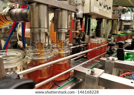 YAD MORDECHAI, ISR - SEP 07:Machine fills jars in Honey for Rosh Hashanah Jewish holiday on Sep 07 2007. Rosh Hashanah meals often include honey, to symbolize a sweet new year.