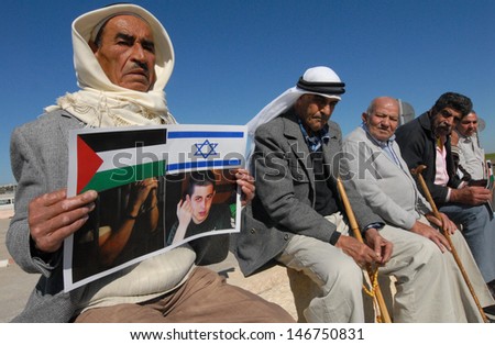 EREZ CROSSING, JAN 11:Arab Israeli men protest on Feb 11, 2010. The group call Hamas to release captured Israeli soldier Gilad Shalit in return for the exchange of Palestinian prisoners in Israel.