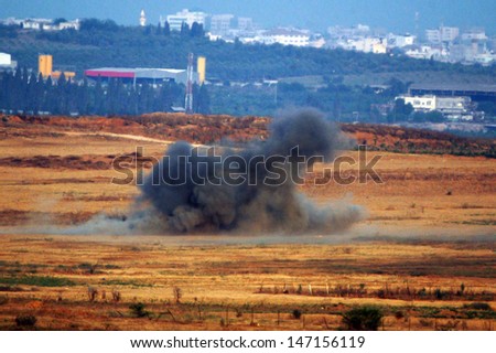 GAZA STRIP - JULY 04:Israeli rocket explodes in open field to prevent from terrorists to fire Qassam rockets on July 4 2006.Since Israel withdrew from the Gaza in 2005 over 8000 rockets hit Israel.