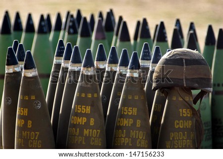 NACHAL OZ , ISR - MAY 30:Israeli artillery soldier helmet on live shells ready to be fired  on May 30 2005.The IDF artillery corp using advanced technology to improve its precision and effectiveness