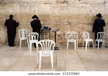 JERUSALEM - OCT 08 :Jewish men pray at the Western Wall during the High Holy Days on Oct 08 2005.During the 10 days before Yom Kippur Holiday Jewish people practice Teshuvah - engaging in repentance.