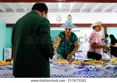 RAROTONGA - SEP 16:Cook Islands woman serve traditional food on sunday morning tea at CICC church on Sep 16 2013.The dominant religion in Cook Islands is Christianity since 1821.
