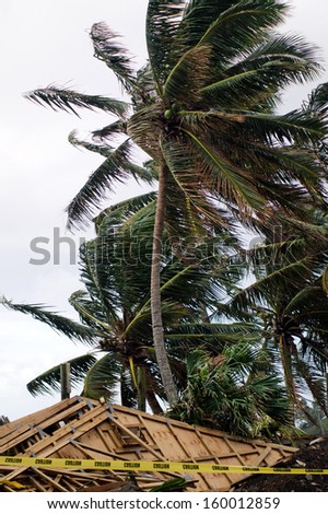 RAROTONGA - SEP 16:Damaged building during tropical storm on Sep 16 2013.Since 1998, the Cook Islands has experienced more intense storms, flooding and wave surges, damaging coastal infrastructure.