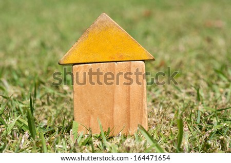 Old houses on green grass. Concept photo of Real estate market bubble , booming, money,price, grid, home, rent, house, housing, industry and subprime mortgage crisis. (Copy Space)
