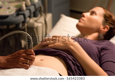 KAITAIA, NZ - NOV 05:Ultrasound scanning in the x-ray lab on Nov 05 2013.A pregnancy ultrasound is an imaging test that uses sound waves to see how a baby is developing in the womb.