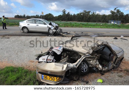 SDEROT, ISR - DEC 12:Traffic policeman in a deadly car accident scene on Dec 12 2008.According to the World Health Organization:1.2M people are killed in traffic accidents each year around the world