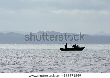 BAY OF ISLANDS, NZ - DEC 12: Small fishing boat on Dec 12 2013.NZ exclusive economic zone covers 4.1 million km2,It\'s the 6th largest zone in the world and 14 times the size of NZ