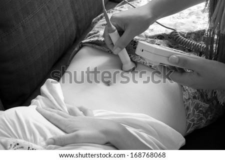 CABLE BAY,NZ:Midwife checks baby heart beat and movement on Dec 12 2013.Midwifery is a health care profession in which providers offer care to women during pregnancy,labor ,birth and postpartum.