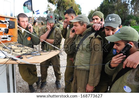 NACHAL OZ, ISR - DEC 29:Israeli soldiers having the last call home during the final preparation of the IDF for a possible land incursion into Gaza strip during cast lead operation on December 29, 2008