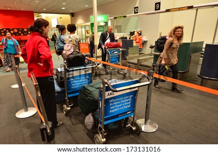 AUCKLAND - JAN 12:Passengers waiting to check-in at Auckland Airport on Jan 12 2014.60% of people check-in through the airlineÃ?Â¢??s main counter, which takes an average of 19 minutes.