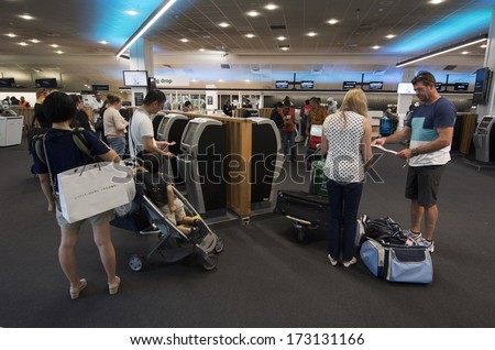 AUCKLNAD - DEC 31:Passengers self checks in at Auckland airport on Dec 31 2013.The service is promoted by airlines to reduces the time a passenger would normally spend at an airport check-in counter.