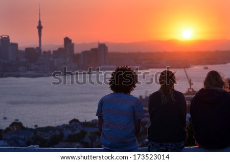 AUCKLAND, NZ - JAN 18:People looks at Auckland downtown during sunset on Jan 18 2014. Auckland has been rated one of the world\'s top 10 cities to visit by travel bible Lonely Planet.