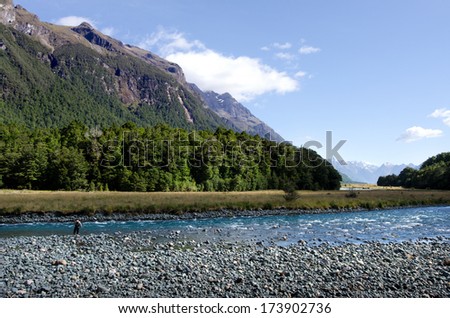 FIORDLAND,NZ - JAN 15:Fisherman fly fishing in Eglinton River on Jan 15 2014.NZ has a world-renowned wild trout fishery and Fiordland area offers many rivers, streams and lakes in stunning locations.